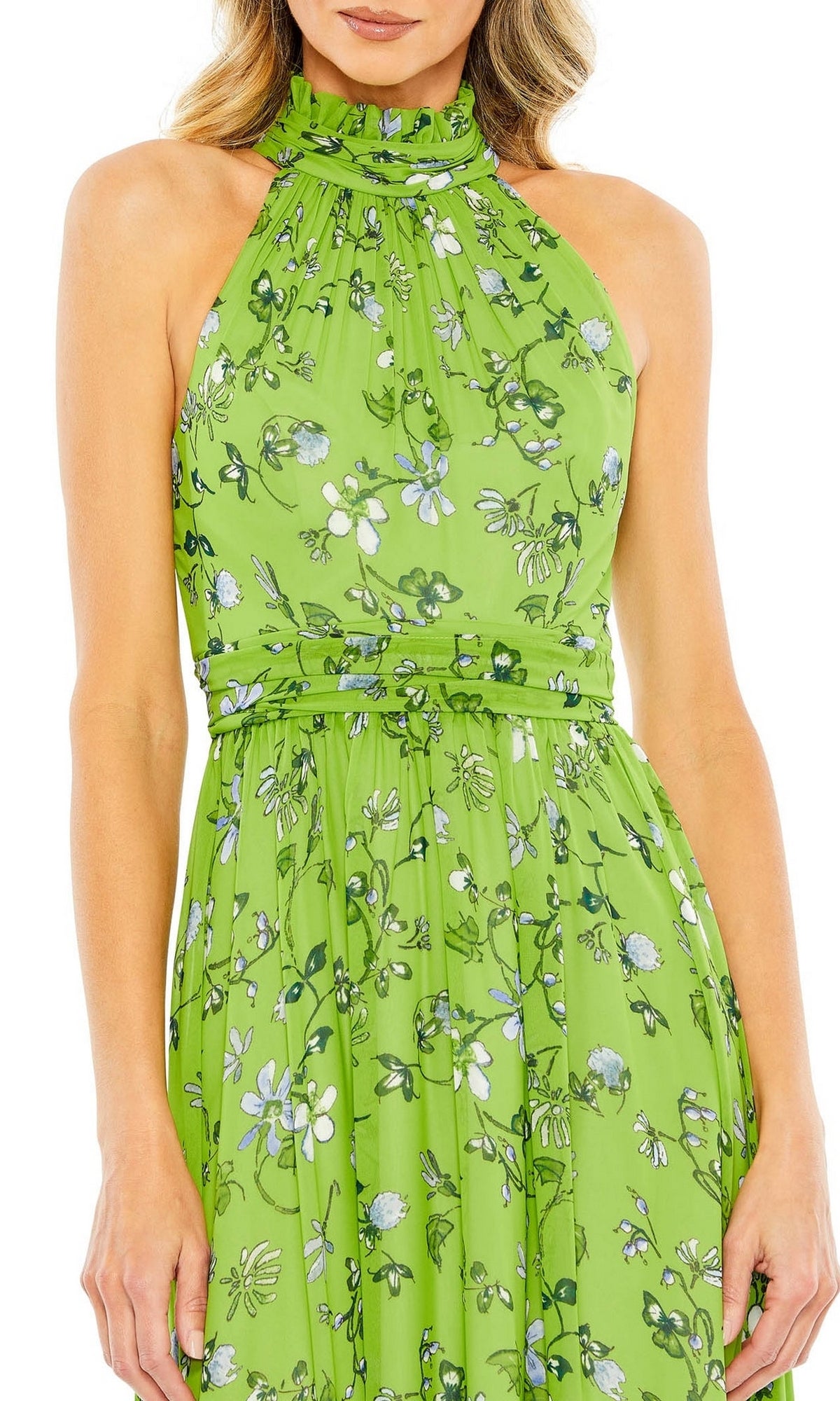 A woman wearing the Short Wedding Guest Dress 55854 by Mac Duggal—a sleeveless sage green midi dress with a floral print, gathered neckline, and fitted waist.